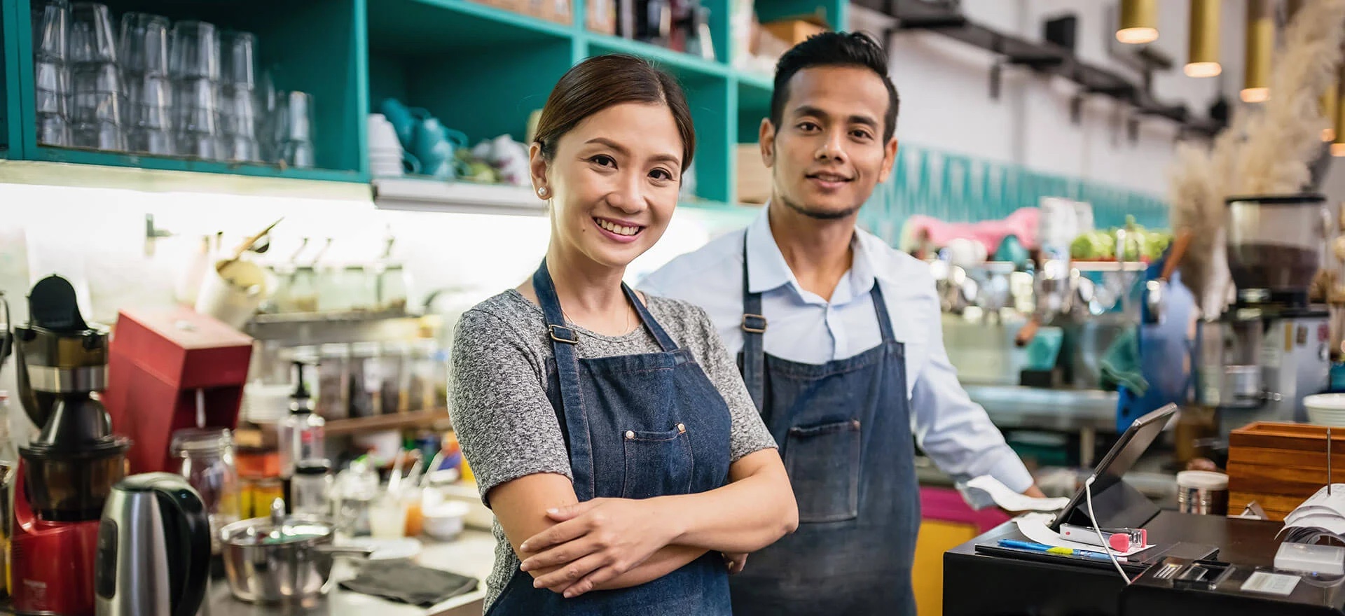 Two small business owners in their shop